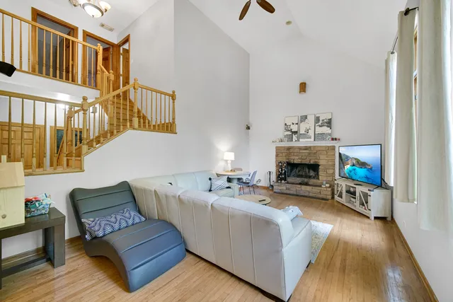 a living room with furniture and a fireplace