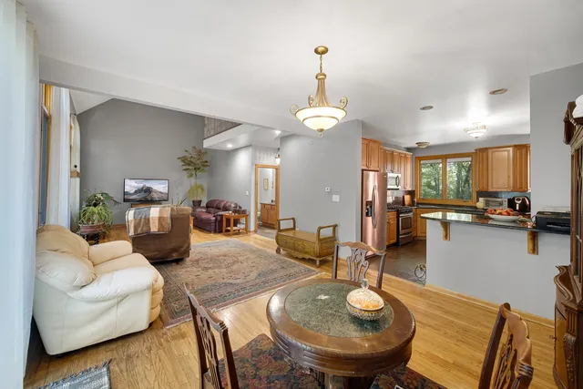 a view of a dining room with furniture and wooden floor