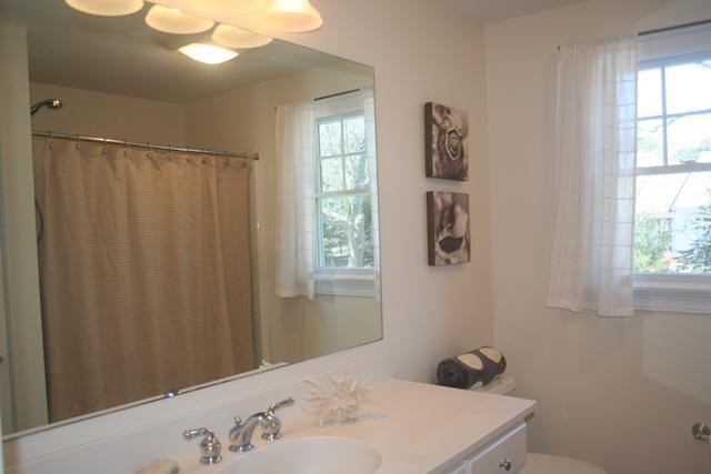 14 Bailey's Path Chatham, MA 02633 - Photo 14 of 20 a bathroom with a sink and a mirror