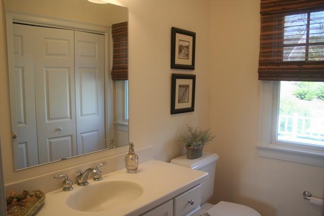 14 Bailey's Path Chatham, MA 02633 - Photo 5 of 20 a bathroom with a sink toilet and a mirror