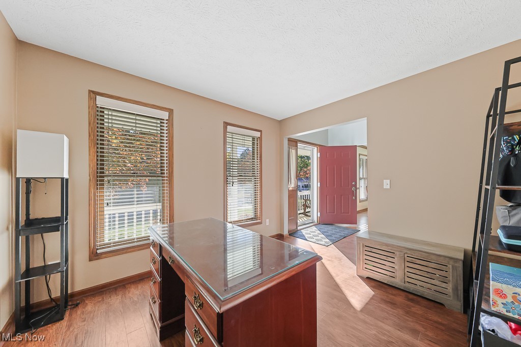 3982 Baird Road Stow, OH 44224 - Photo 4 of 50 Home office with light wood finished floors and a textured ceiling