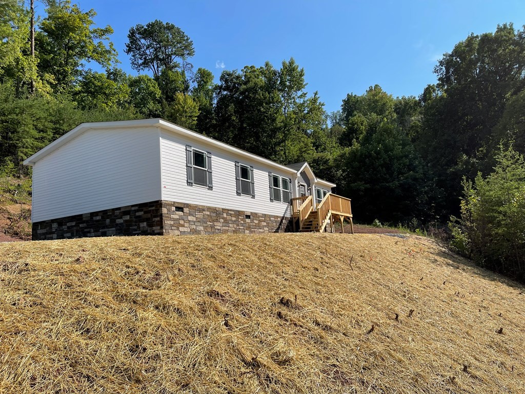 1348 Bluets Road Newport, TN 37821 - Photo 40 of 47 a front view of a house with a yard and garage