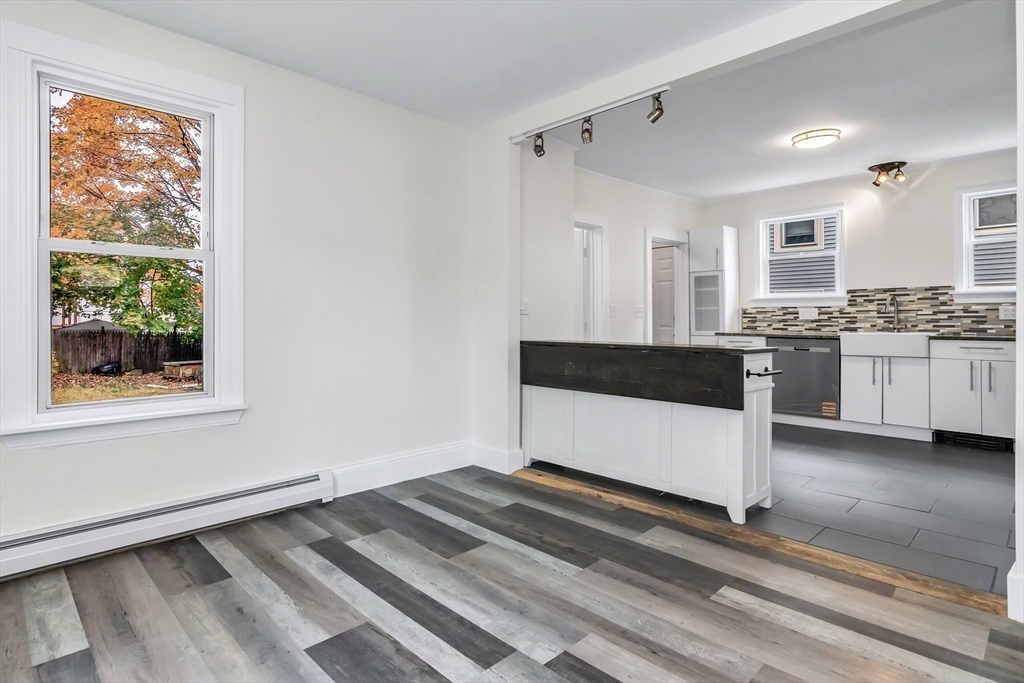 6 Dexter Street Haverhill, MA 01830 - Photo 11 of 42 a spacious bathroom with a granite countertop tub sink and mirror