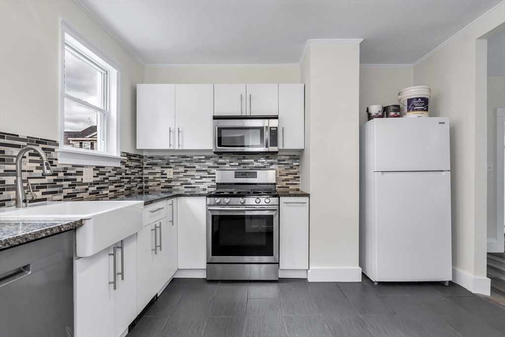 6 Dexter Street Haverhill, MA 01830 - Photo 18 of 42 a kitchen with cabinets stainless steel appliances and a sink