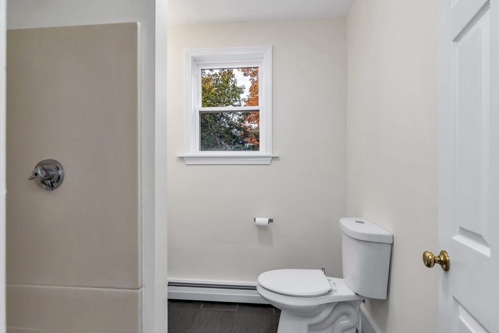 6 Dexter Street Haverhill, MA 01830 - Photo 22 of 42 a white toilet sitting next to a white sink