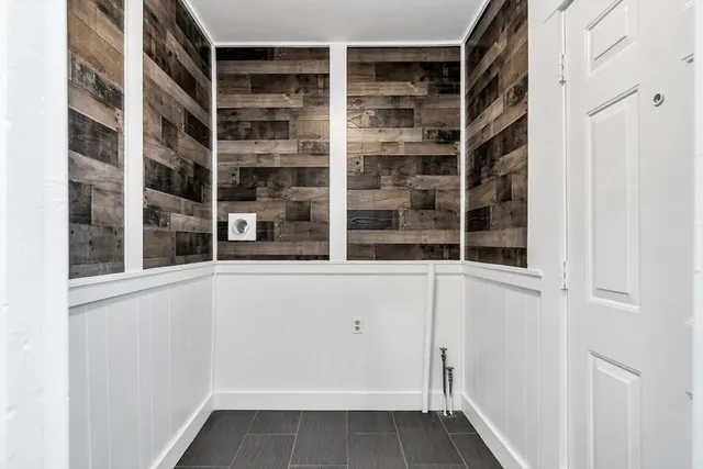 a bathroom with a tub a toilet and a shower