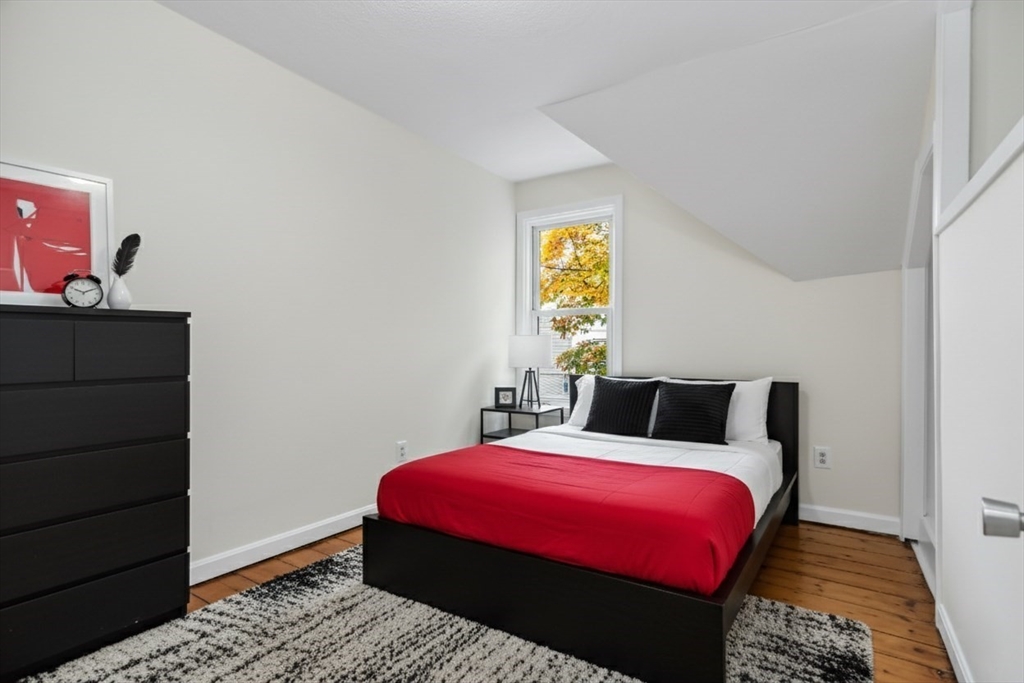 6 Dexter Street Haverhill, MA 01830 - Photo 29 of 42 a bedroom with a bed and a window