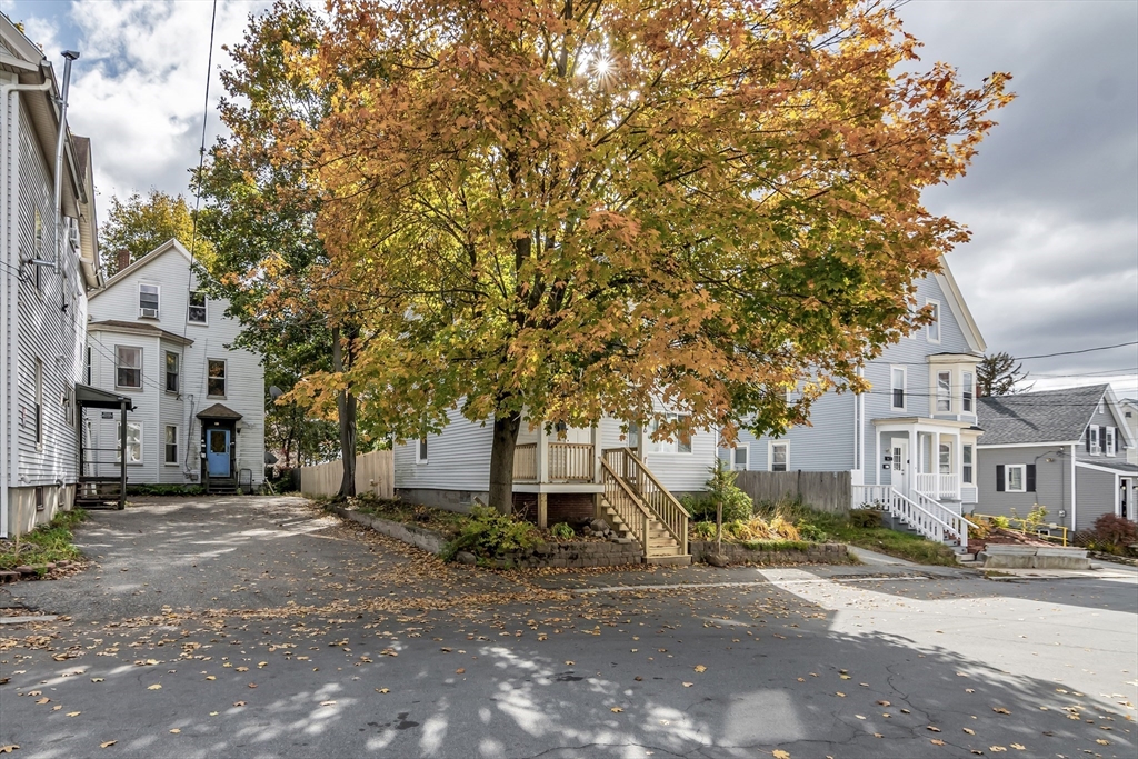 6 Dexter Street Haverhill, MA 01830 - Photo 3 of 42 a front view of a house with a yard and garage