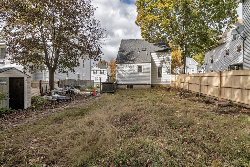 6 Dexter Street Haverhill, MA 01830 - Photo 41 of 42 a view of a yard with wooden fence
