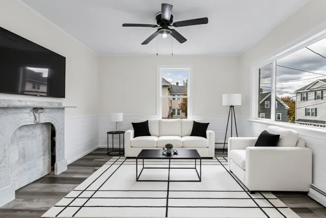 a kitchen with granite countertop a table chairs stove and cabinets