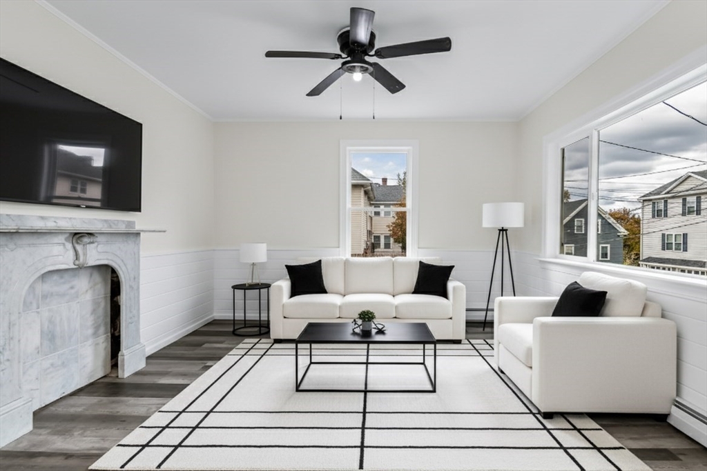 6 Dexter Street Haverhill, MA 01830 - Photo 6 of 42 a living room with furniture and a fireplace