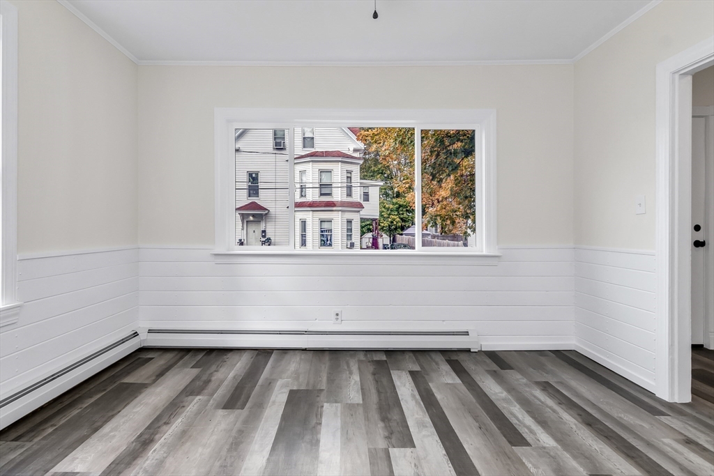 6 Dexter Street Haverhill, MA 01830 - Photo 8 of 42 a view of a room with wooden floor and window