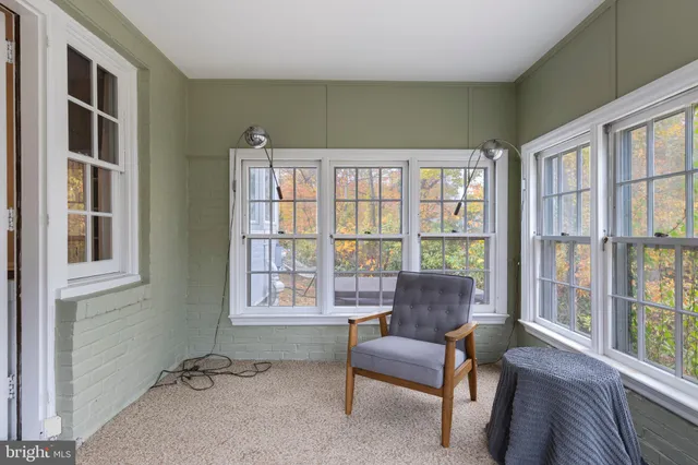 a view of a livingroom with furniture and a window