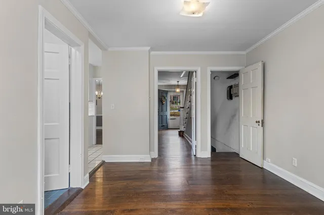 wooden floor with white walls