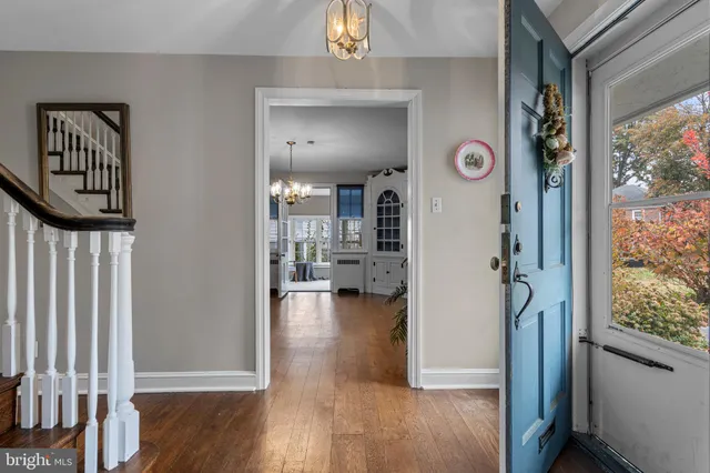 a view of front door with wooden floor