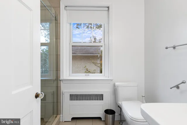 a bathroom with a toilet and a sink