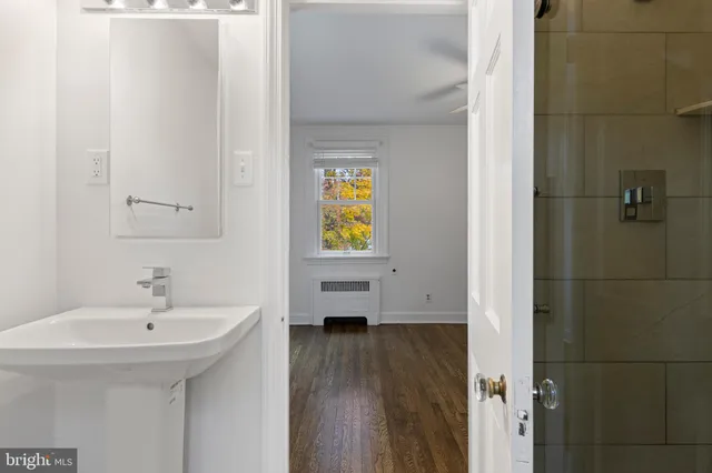 a bathroom with a sink and a window