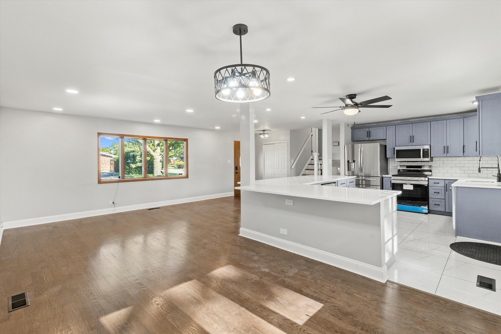 325 Indiana Street Park Forest, IL 60466 - Photo 11 of 28 a view of a kitchen with a sink stainless steel appliances and cabinets