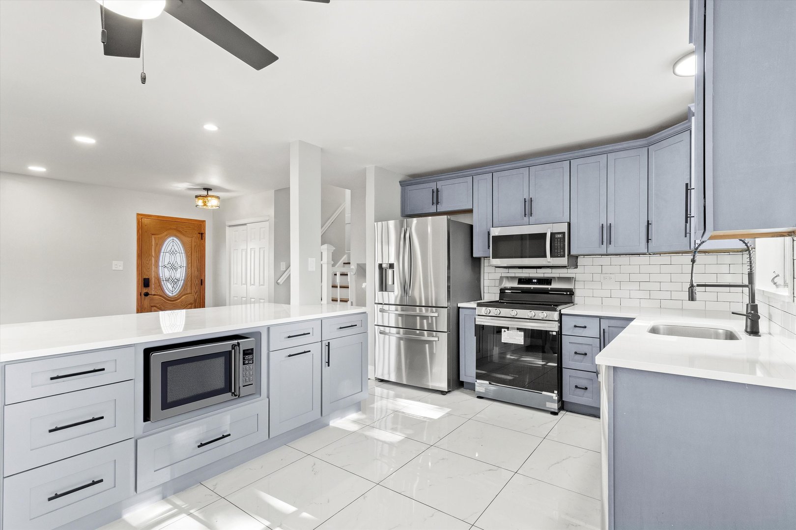 325 Indiana Street Park Forest, IL 60466 - Photo 13 of 28 a kitchen with a stove a sink and a refrigerator