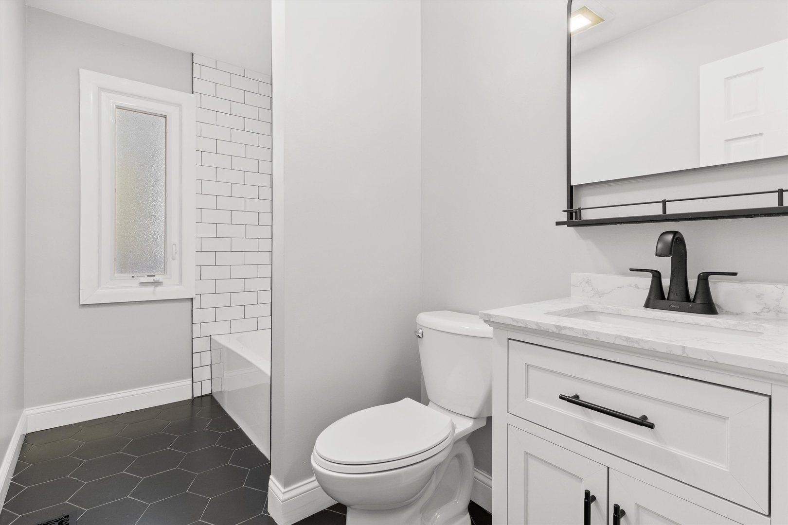 325 Indiana Street Park Forest, IL 60466 - Photo 14 of 28 a bathroom with a toilet sink and mirror