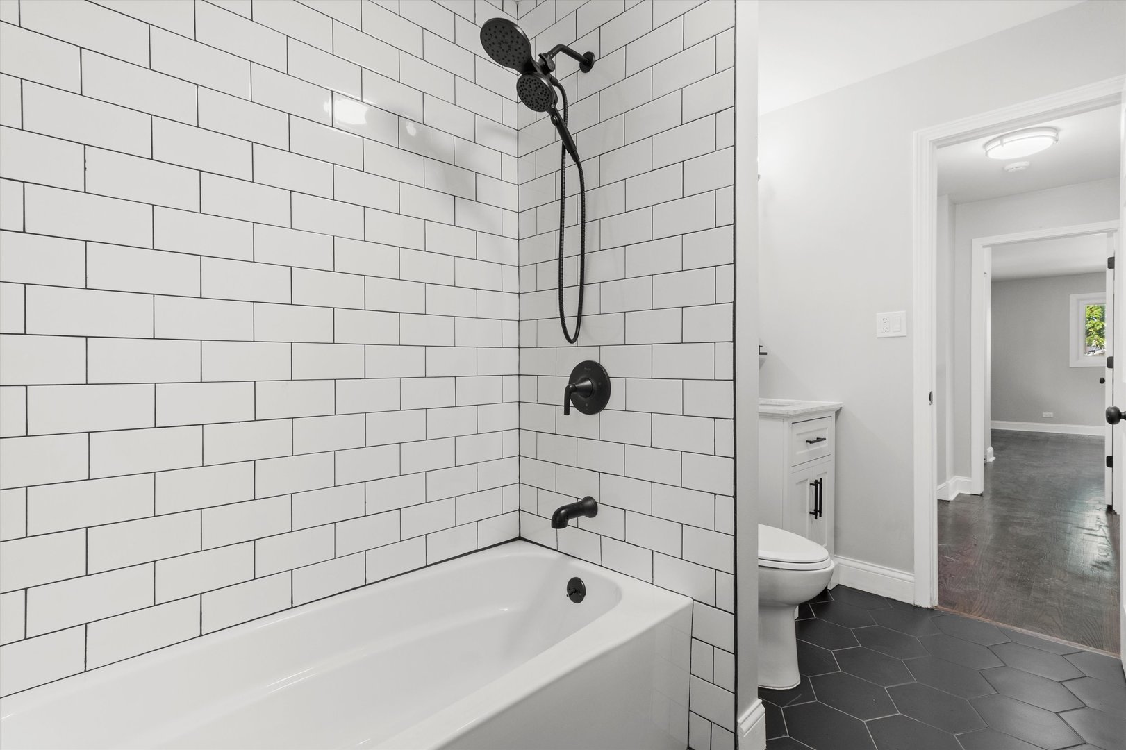 325 Indiana Street Park Forest, IL 60466 - Photo 15 of 28 a bathroom with a bathtub and shower