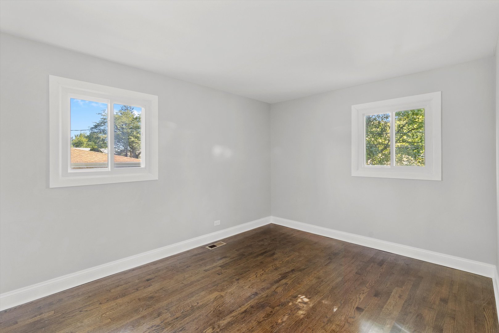 325 Indiana Street Park Forest, IL 60466 - Photo 17 of 28 a view of an empty room with wooden floor and a window
