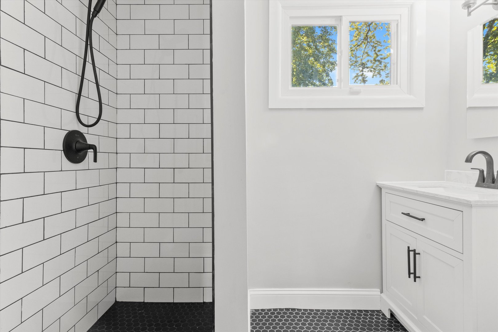 325 Indiana Street Park Forest, IL 60466 - Photo 23 of 28 a bathroom with a sink and a shower