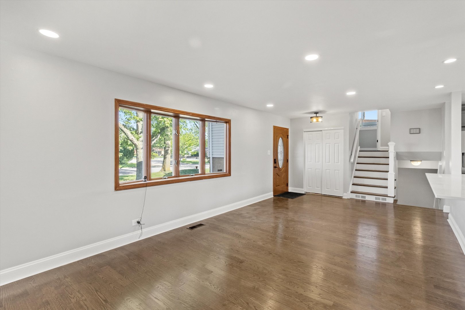 325 Indiana Street Park Forest, IL 60466 - Photo 5 of 28 an empty room with wooden floor and windows