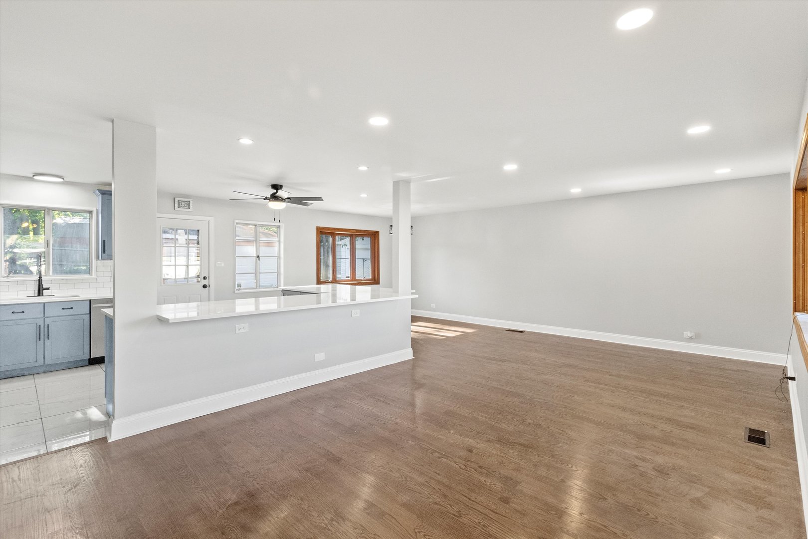 325 Indiana Street Park Forest, IL 60466 - Photo 7 of 28 an empty room with wooden floor and windows