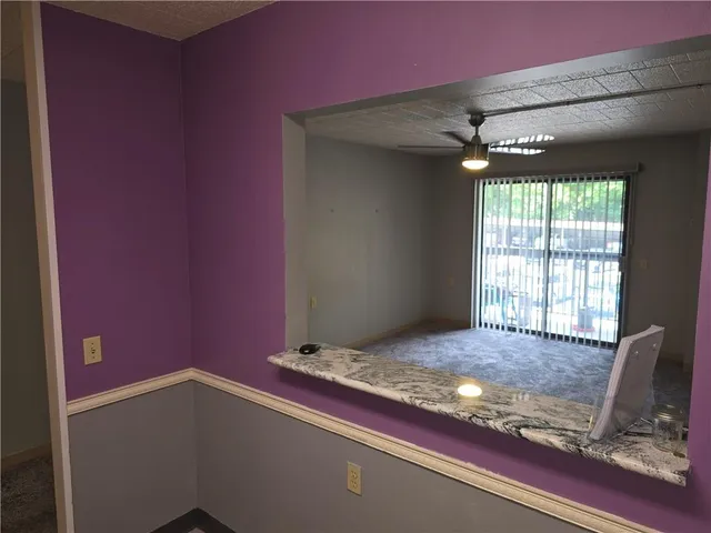 a view of an empty room and window