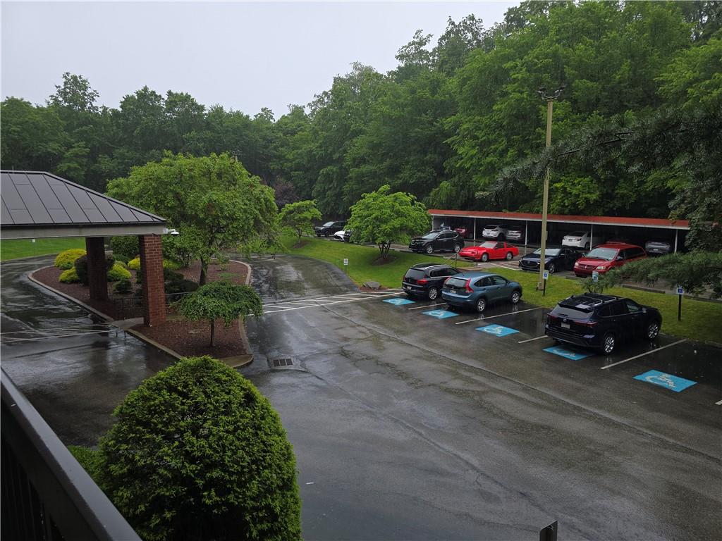 1987 Centurion Drive, Unit 202 Pittsburgh, PA 15221 - Photo 27 of 27 a view of a chair and tables in the back yard of the house
