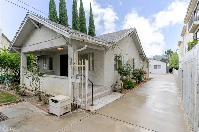 a view of house with patio outdoor seating and garage