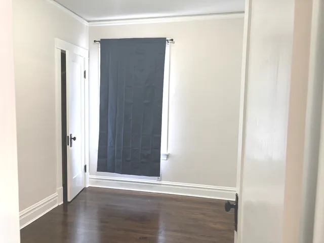 a view of a small space with wooden floor