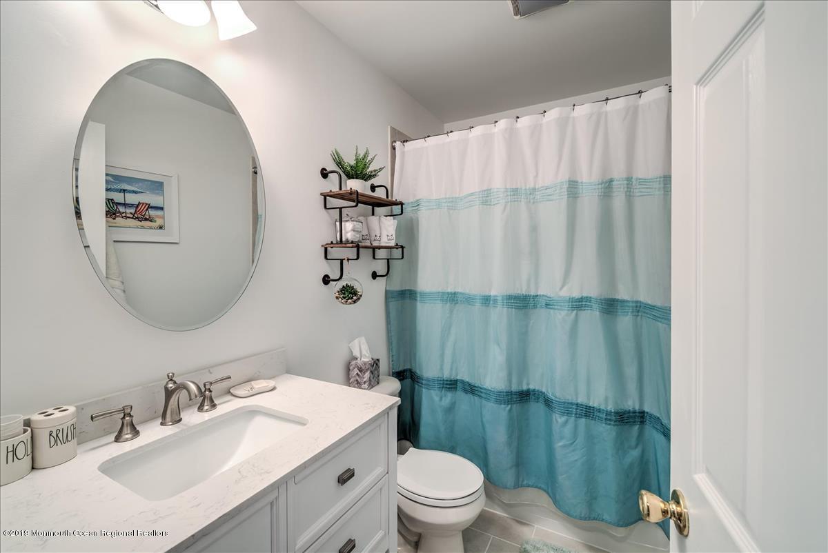 130 Crine Road Morganville, NJ 07751 - Photo 36 of 46 a bathroom with a sink toilet and shower