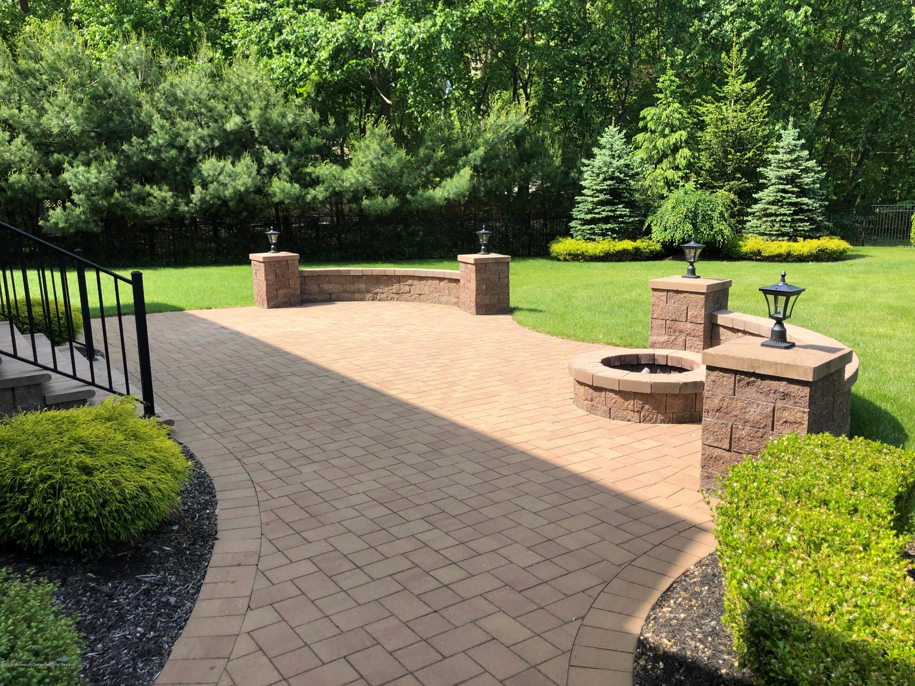 130 Crine Road Morganville, NJ 07751 - Photo 42 of 46 a view of a garden with an outdoor space