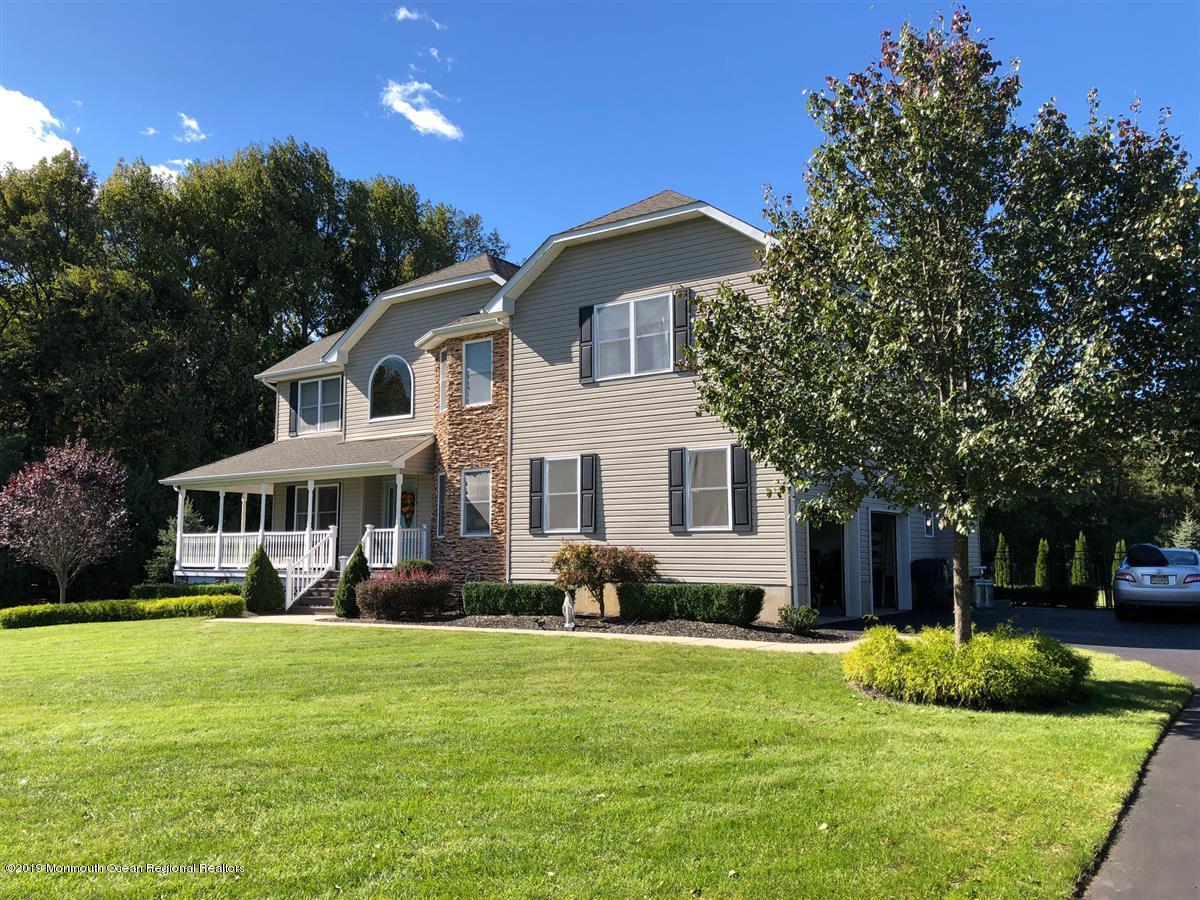 130 Crine Road Morganville, NJ 07751 - Photo 46 of 46 a front view of a house with a yard