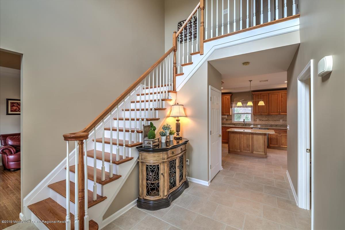 130 Crine Road Morganville, NJ 07751 - Photo 9 of 46 a view of entryway kitchen and hall way with furniture