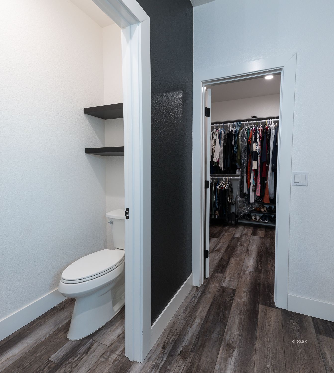444 Jacks Ranch Road Ridgecrest, CA 93555 - Photo 32 of 48 a bathroom with a toilet and a wooden floor