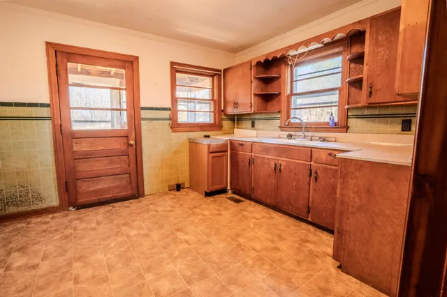 a view of a kitchen with furniture and window