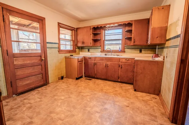 a bath room with a sink and a mirror