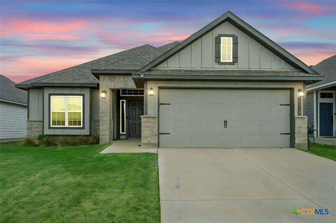 113 Lazy Lizzy Road Jarrell, TX 76537 - Photo 1 of 29 a front view of a house with a yard