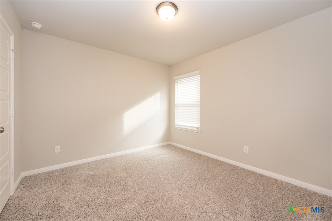 113 Lazy Lizzy Road Jarrell, TX 76537 - Photo 21 of 29 an empty room with windows