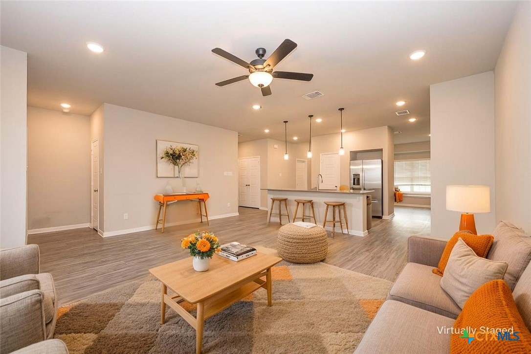 113 Lazy Lizzy Road Jarrell, TX 76537 - Photo 3 of 29 a living room with furniture and kitchen view