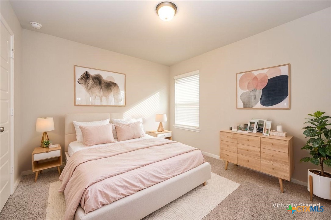 113 Lazy Lizzy Road Jarrell, TX 76537 - Photo 7 of 29 a bedroom with a bed and a desk