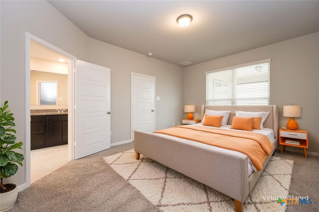 113 Lazy Lizzy Road Jarrell, TX 76537 - Photo 9 of 29 a bedroom with a large bed and a closet