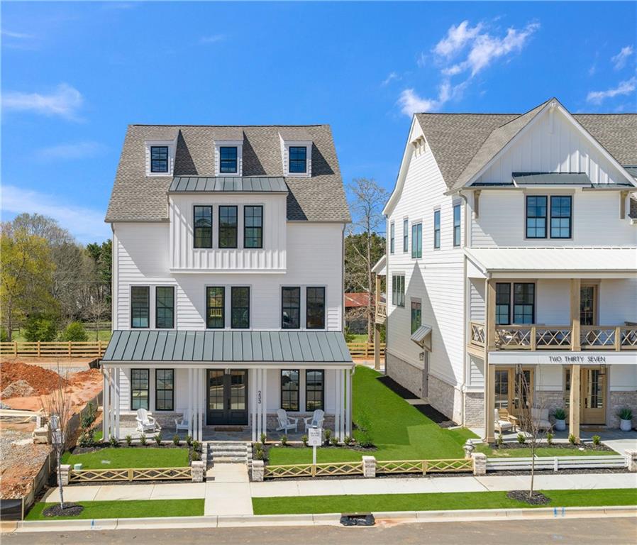 233 Lask Lane Milton, GA 30004 - Photo 1 of 1 a front view of a residential apartment building with a yard