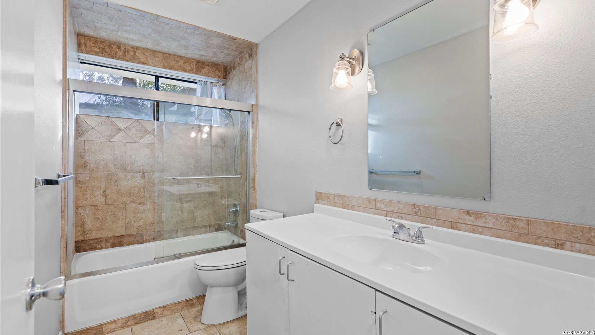 8642 Fredericksburg Road, Unit 405 San Antonio, TX 78240 - Photo 16 of 24 a bathroom with a sink a toilet and shower