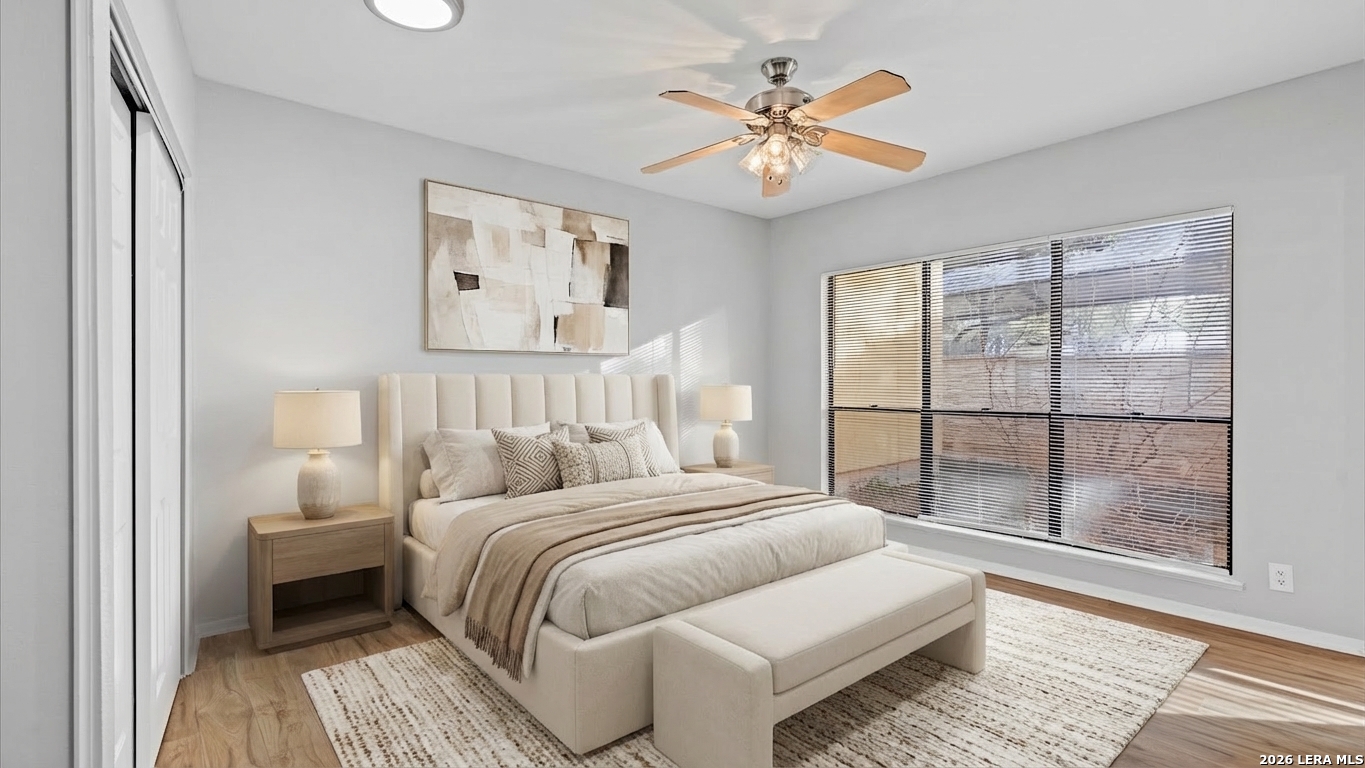 8642 Fredericksburg Road, Unit 405 San Antonio, TX 78240 - Photo 18 of 24 a bedroom with a large bed and a window