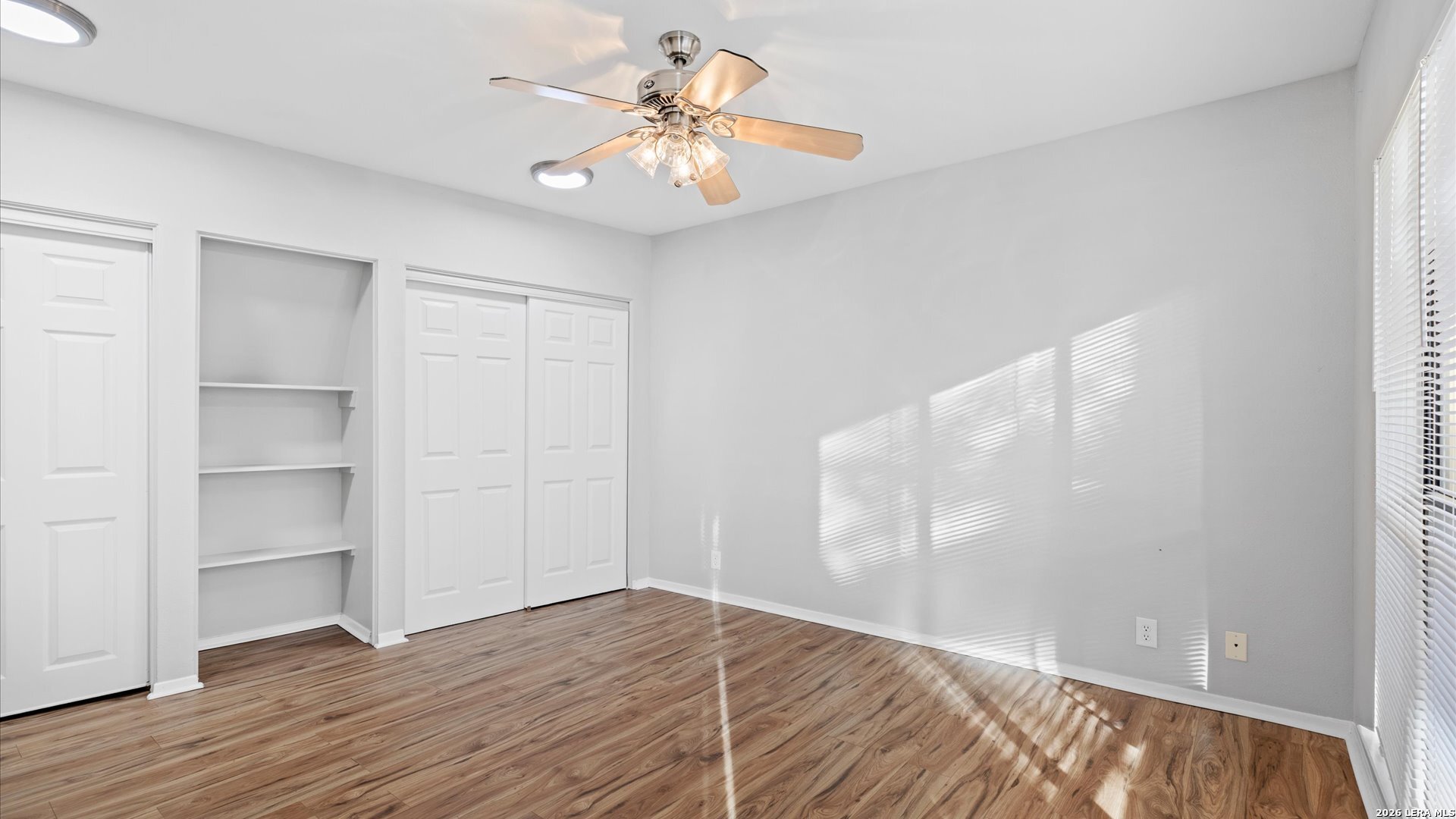 8642 Fredericksburg Road, Unit 405 San Antonio, TX 78240 - Photo 20 of 24 a view of empty room with wooden floor and fan