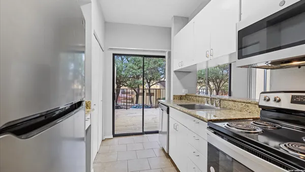 a kitchen with a stove and a sink
